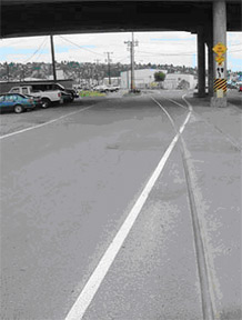 Ballard neighborhood bicycle lawsuit against Seattle for hazardous road too many cyclist crashes on railroad track road angle