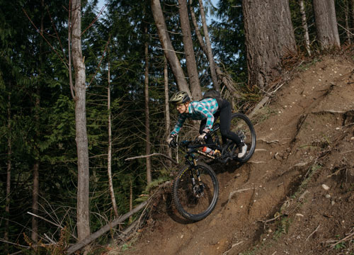 Seattle bicycle lawyer Jessica Cutler riding her mountain bike down a steep decent in Washington.